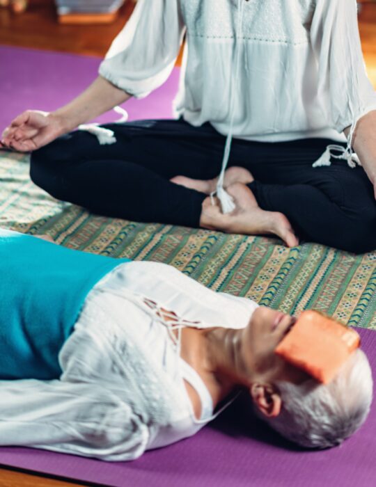 Senior woman on a guided meditation class